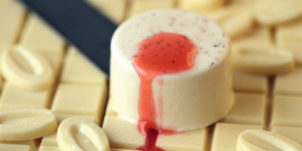Tonka bean ivory panna cotta with strawberry coulis