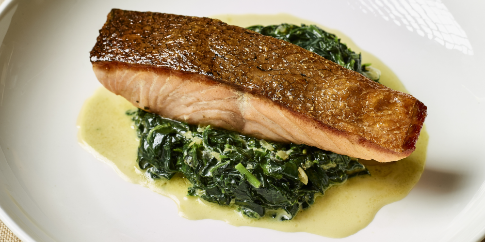 Pan-fried salmon with spinach, watercress and Saint Agur blue cheese sauce