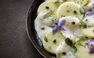 Carpaccio of scallops with Abondance cheese and passion fruit