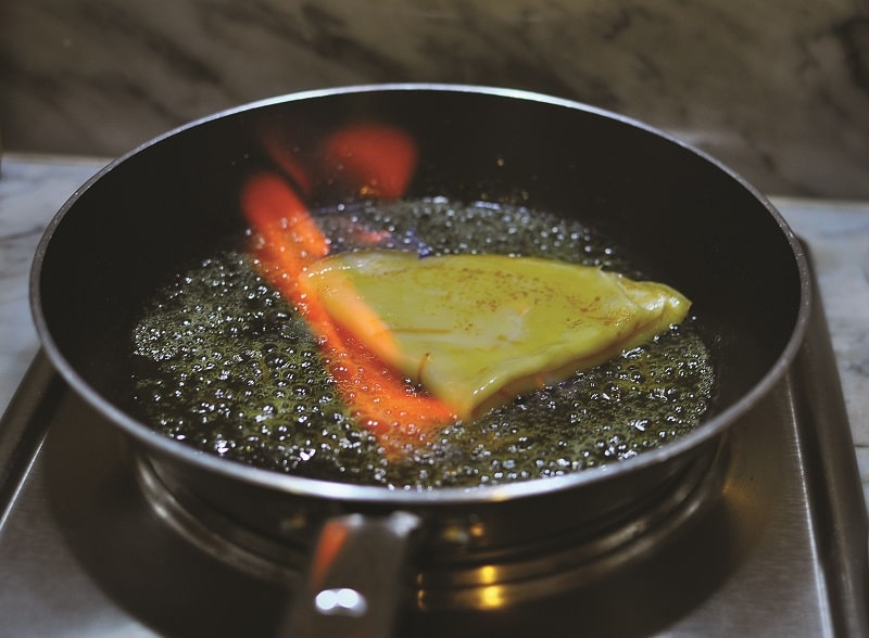 Sizziling crepe in pan