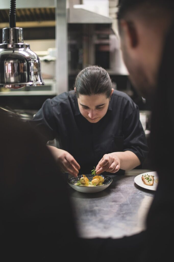 Julia Sedefjian plating up a dish