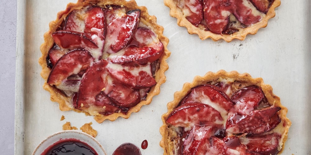 Comté, plum & cherry tartlets