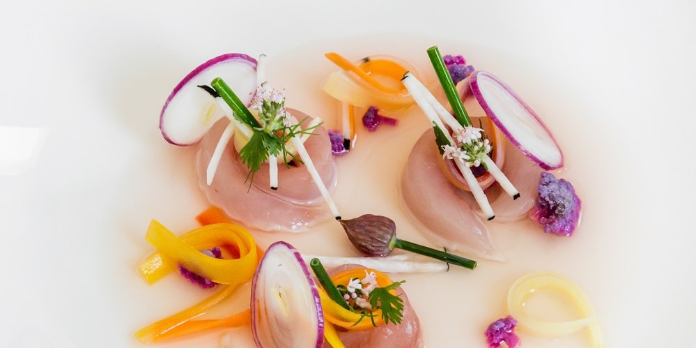 Mackerel served in a savoury lemon broth