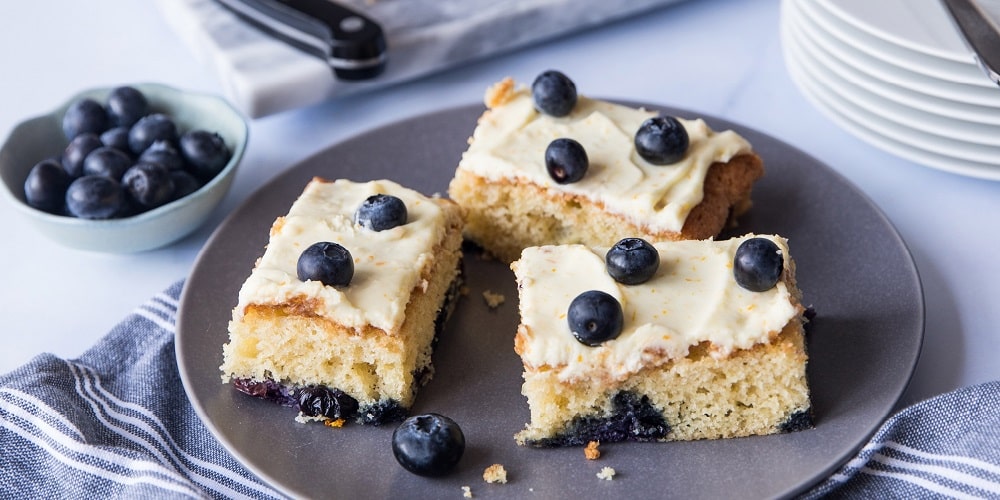 Blueberry traybake with orange cream cheese frosting