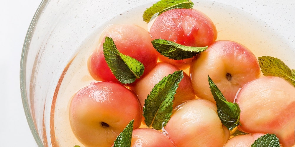 Vine peaches poached in green tea syrup with mint
