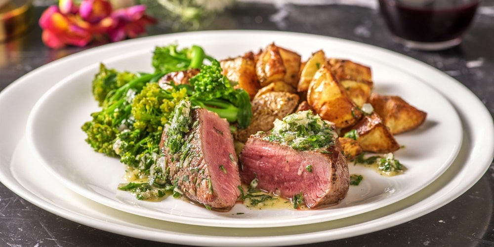 Sirloin steak and bearnaise butter with roasties and tenderstem broccoli