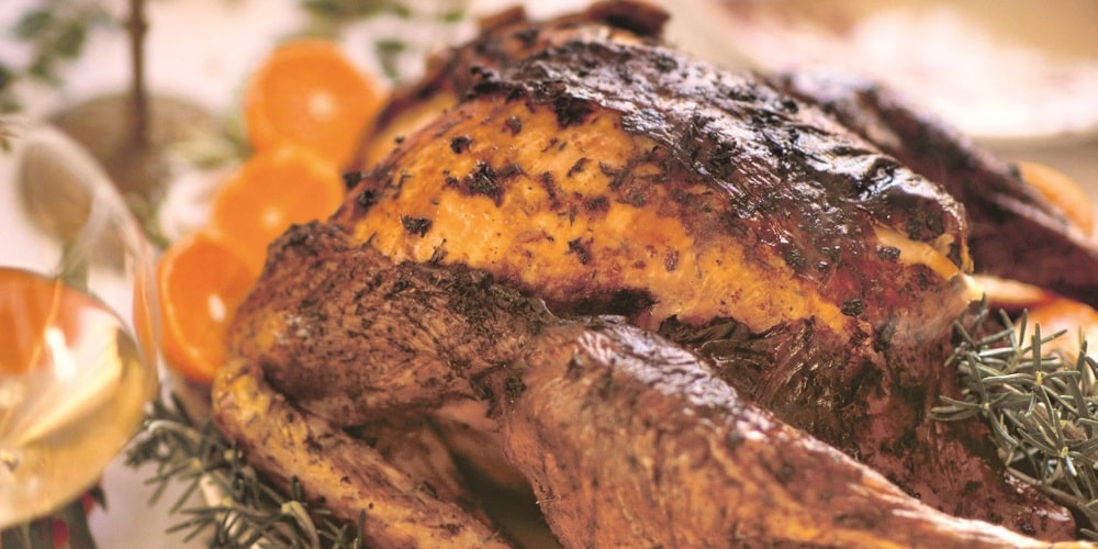 Roast turkey with clementines and garlic