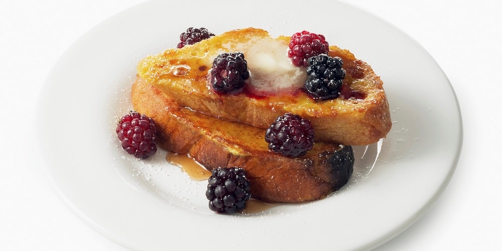 French toast with fresh berries and maple syrup