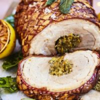Rolled porchetta with pistachios, fennel and lemon