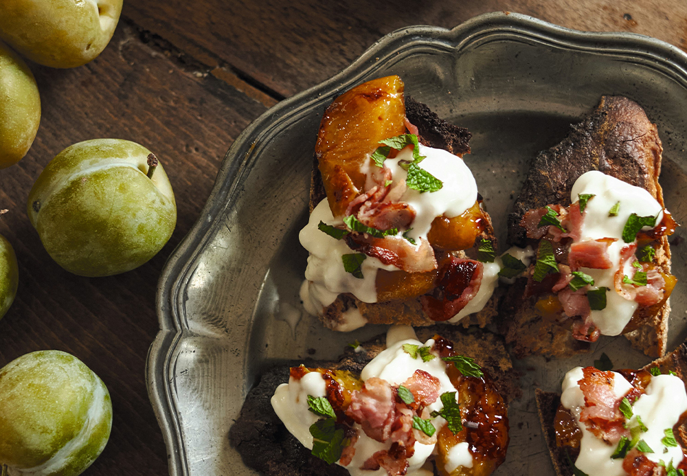 Greengage plum, bacon and burrata crostini