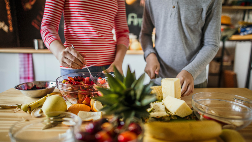 Two people cooking